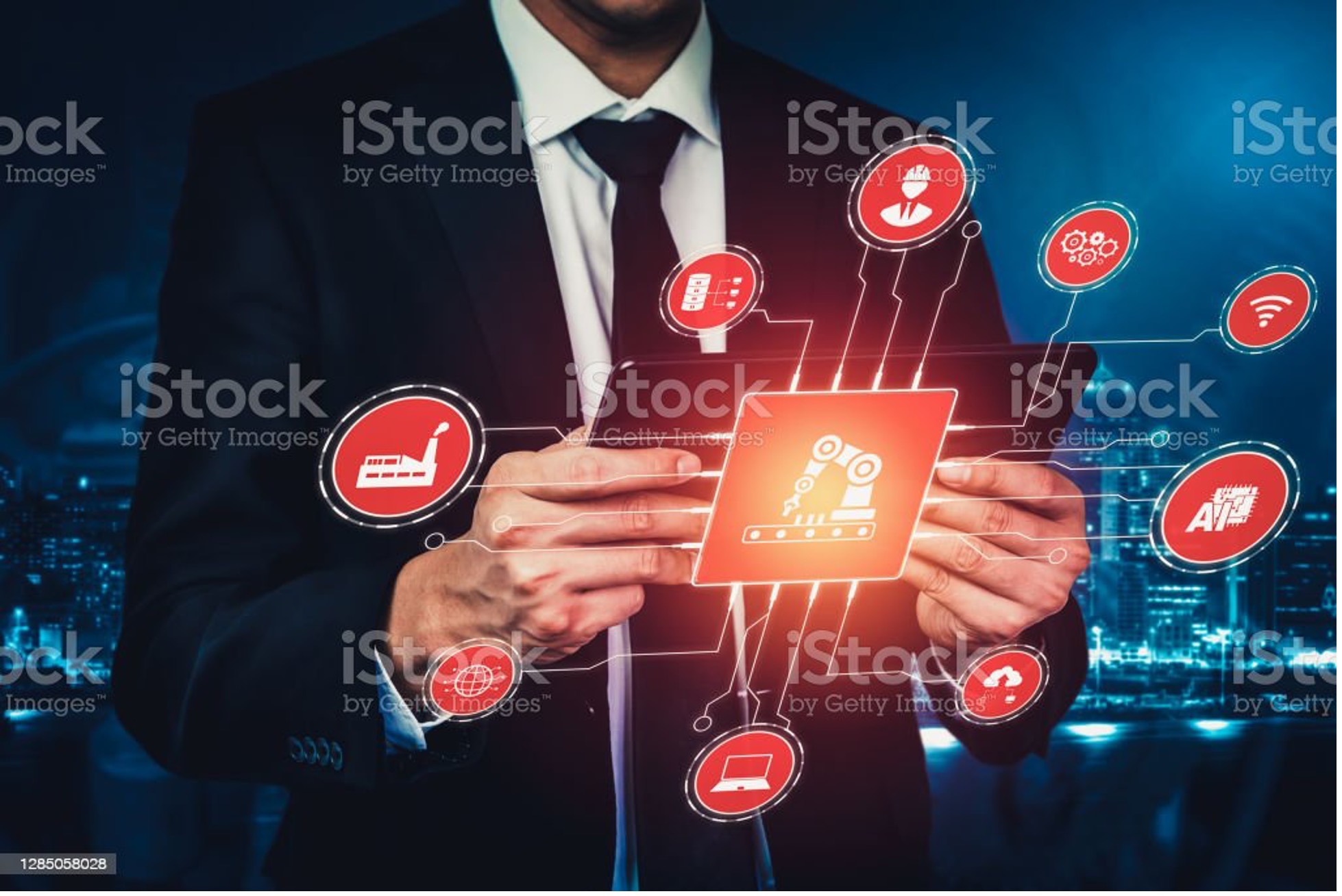 A man with a tablet is his hands and a lot of logistics icons